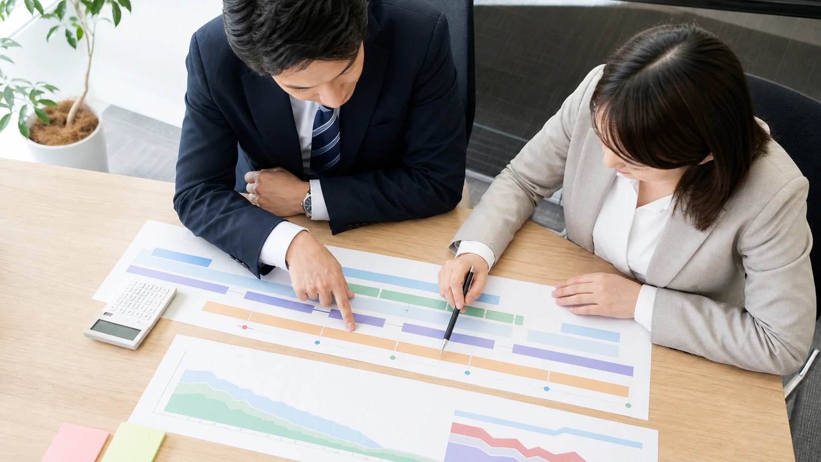 財務担当者が借入残高と満期を月別返済カレンダーへ変換する場面